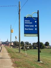 Wayfinding sign directing to Historic Downtown, Visitor Center, and River District
