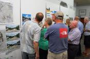 Visitors and Stantec staff look over idea boards.